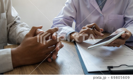 Psychiatrist consulting on diagnostic examination disease or mental illness in medical clinic. 69805609