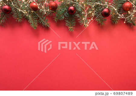 Christmas frame with evergreen branches, garland. 69807489