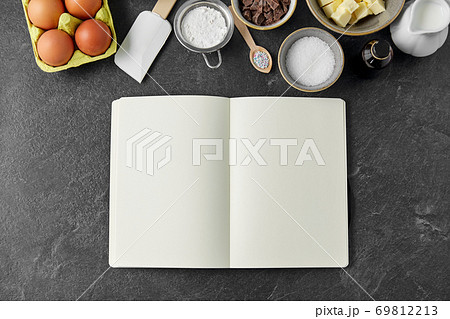 recipe book and cooking ingredients on table recipe book and cooking ingredients on table 69812213
