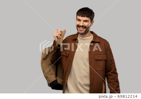 happy smiling young man with backpack 69812214