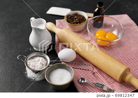 rolling pin, milk, eggs, flour and chocolate 69812347