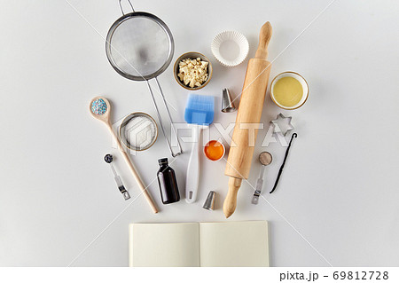 recipe book and cooking ingredients on table 69812728