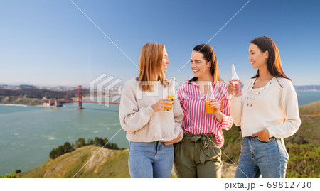 young women with drinks talking in san francisco 69812730