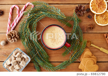 cup of eggnog, fir branches, gingerbread and sugar cup of eggnog, fir branches, gingerbread and sugar 69812790