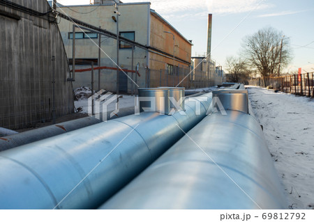 outdoor pipeline and old hangar in winter outdoor pipeline and old hangar in winter 69812792