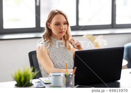 businesswoman with laptop working at office businesswoman with laptop working at office 69813970