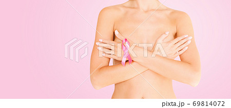 woman with pink breast cancer awareness ribbon 69814072
