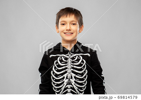 boy in black halloween costume with skeleton bones 69814579