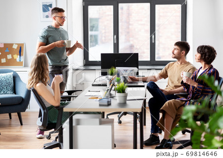 team of startuppers drinking coffee at office team of startuppers drinking coffee at office 69814646