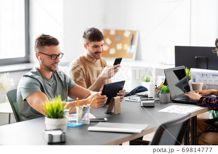 business team or startuppers working at office business team or startuppers working at office 69814777