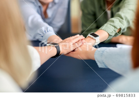 close up of business team stacking hands close up of business team stacking hands 69815833