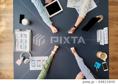 business team showing thumbs up at office table business team showing thumbs up at office table 69815840