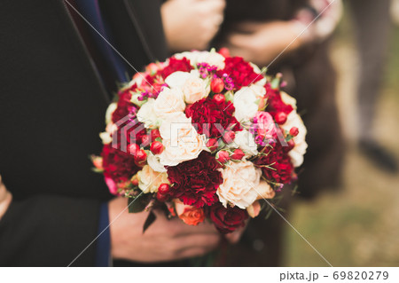Wonderful luxury wedding bouquet of different flowers Wonderful luxury wedding bouquet of different flowers 69820279