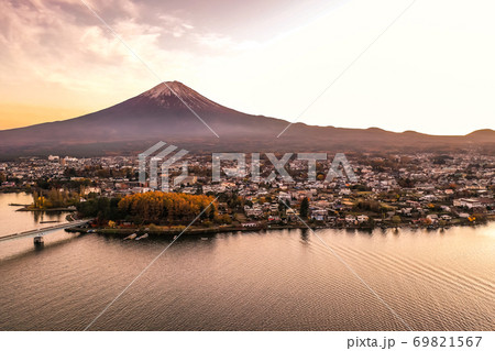 Aerial view over lake Kawaguchi, located in the border Fujikawaguchiko and Minobu, southern Yamanashi Prefecture near Mount Fuji, Japan. Lake Kawaguchi is a very popular tourist spot near Fuji Japan. 69821567