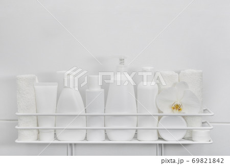 White bottles of cosmetic beauty products in bath 69821842