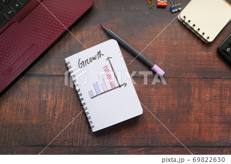 hand written growth chart on notepad at office desk hand written growth chart on notepad at office desk 69822630