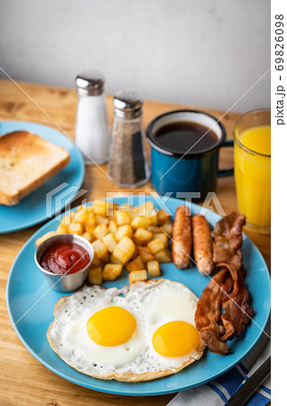 traditional american breakfast on wooden table 69826098