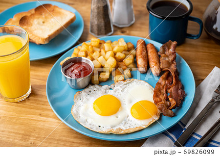 traditional american breakfast on wooden table 69826099