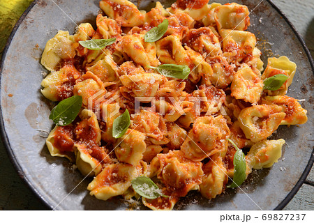 Ravioli with tomato sauce 69827237