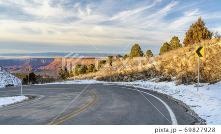scenic windy mountain road in winter scenery 69827928