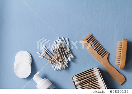 Organic skin care products for cosmetic removal and home spa procedures. Bamboo hairbrush and sticks, cotton pads and cleansing foam.  69830132