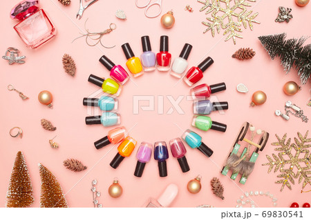 christmas concept, new year, manicure with nail polish, pedicure on pink background, copy space, Flat Lay christmas concept, new year, manicure with nail polish, pedicure on pink background, copy space, Flat Lay 69830541