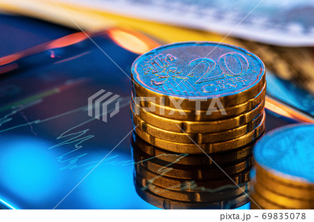 Euro coin on stock chart. Financial investment concept. Euro coin on stock chart. Financial investment concept. 69835078