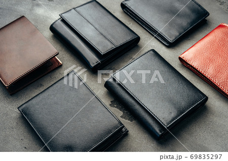 Male leather wallets on grey concrete background 69835297
