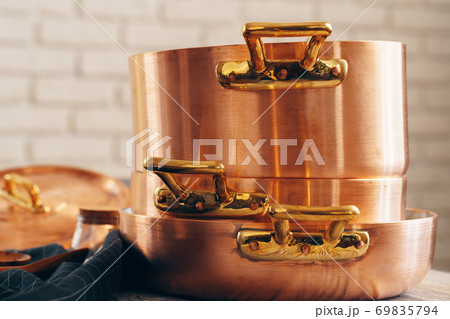 New copper cookware for professional kitchen close up 69835794