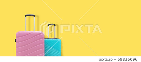 Two suitcases on a yellow background. Copy space 69836096
