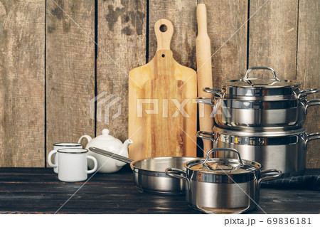 Set of dishware against old wooden background Set of dishware against old wooden background 69836181