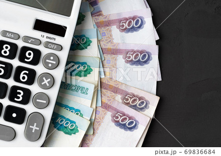 Close up photo of stack of Russian money rubles with calculator 69836684
