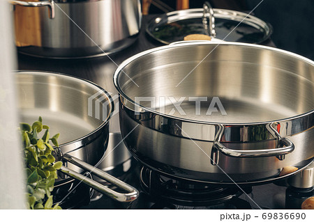 Frying pan on the gas stove in a kitchen Frying pan on the gas stove in a kitchen 69836690