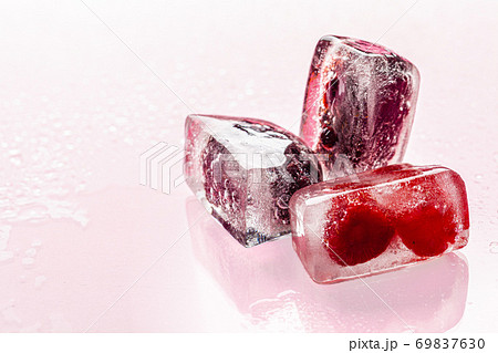 Close up of ice cubes with berries Close up of ice cubes with berries 69837630