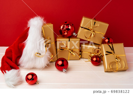 Christmas gift boxes against red background front view Christmas gift boxes against red background front view 69838122