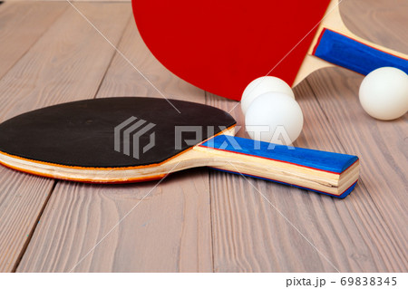 Ping pong equipment on wooden table close up Ping pong equipment on wooden table close up 69838345