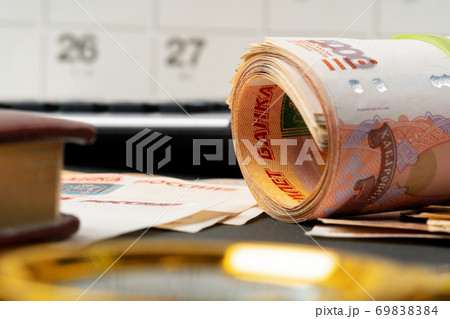 Magnifying Glass on the Russian Currency Rubles Magnifying Glass on the Russian Currency Rubles 69838384