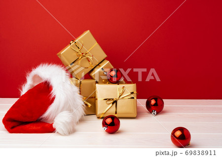 Christmas gift boxes against red background front view Christmas gift boxes against red background front view 69838911