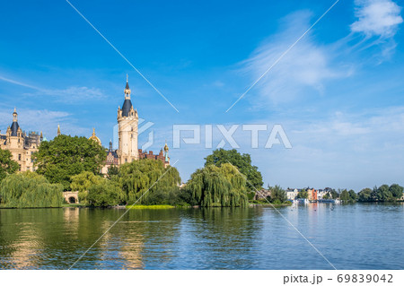 A beautiful fairy-tale castle in Schwerin, the view from the lake 69839042