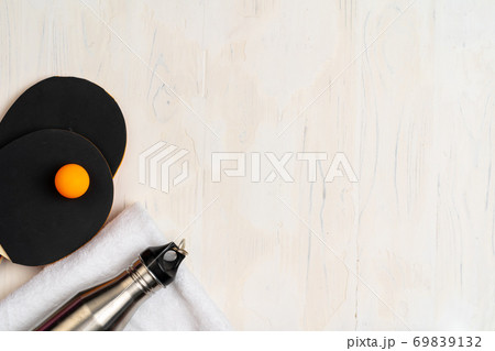 Ping pong equipment. Two rackets and ball, top view 69839132
