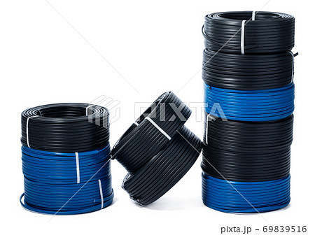 Coils of black and blue cable isolated on white background Coils of black and blue cable isolated on white background 69839516