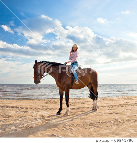 girl with horse on seacoast girl with horse on seacoast 69841796