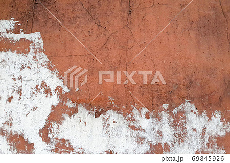 Old plaster texture. Cracked white red brown concrete wall. 69845926