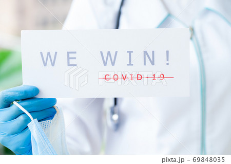 Covid-19, doctor holds a form with the text we win Covid-19, doctor holds a form with the text we win 69848035