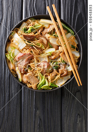 Stir-fried Pork And Cabbage Glass Noodles  close-up in a plate. Vertical top view 69848893