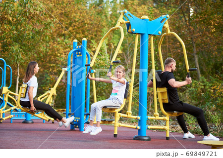 Active family time at the outdoor gym Active family time at the outdoor gym 69849721