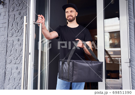 Handsome pizza deliver day time shot 69851390
