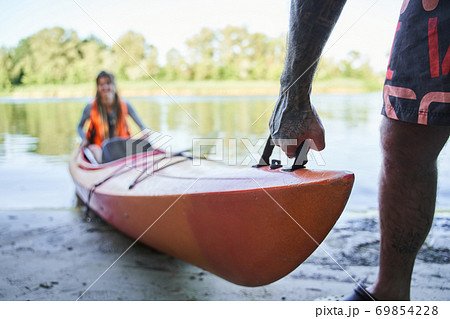 Close up shot of camping canoe on beach Close up shot of camping canoe on beach 69854228