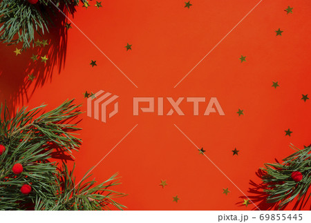 Christmas background with a Christmas tree on a red background. Merry Christmas card. Winter holiday theme. Happy New Year. Place for your text. Christmas background with a Christmas tree on a red background. Merry Christmas card. Winter holiday theme. Happy New Year. Place for your text. 69855445