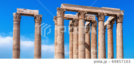 Panoramic view of Corinthian columns of Olympian Zeus temple on sky background, Athens, Greece. 69857103
